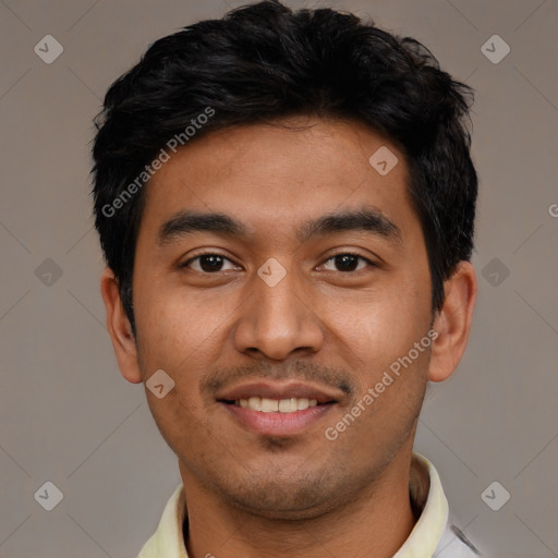 Joyful latino young-adult male with short  black hair and brown eyes