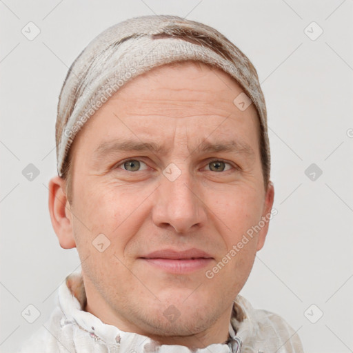 Joyful white adult male with short  brown hair and grey eyes