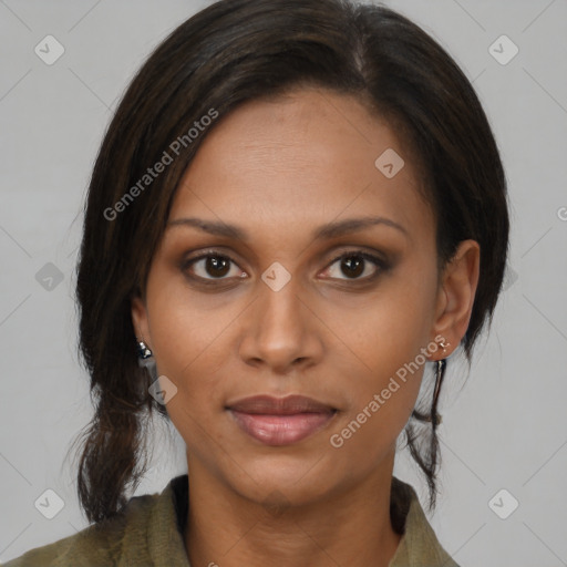 Joyful black young-adult female with medium  brown hair and brown eyes