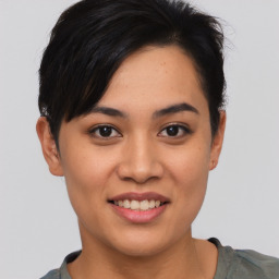 Joyful asian young-adult female with short  brown hair and brown eyes