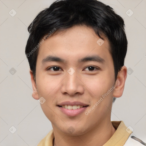 Joyful asian young-adult male with short  brown hair and brown eyes