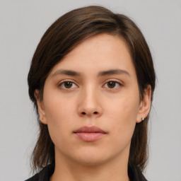 Neutral white young-adult female with medium  brown hair and brown eyes