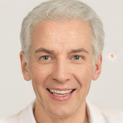 Joyful white middle-aged male with short  gray hair and blue eyes