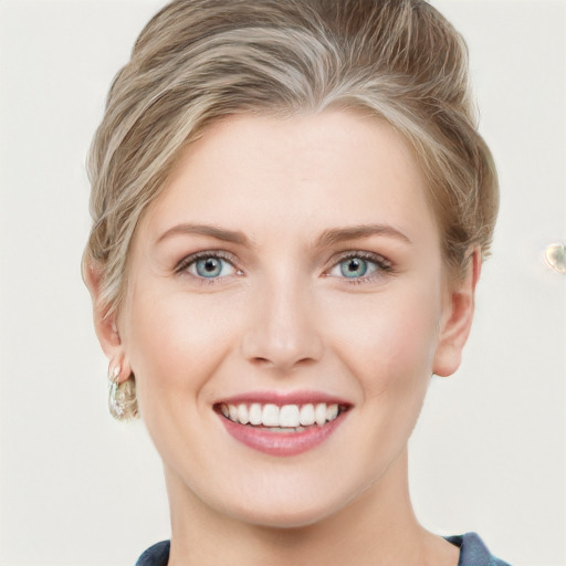 Joyful white young-adult female with medium  brown hair and blue eyes