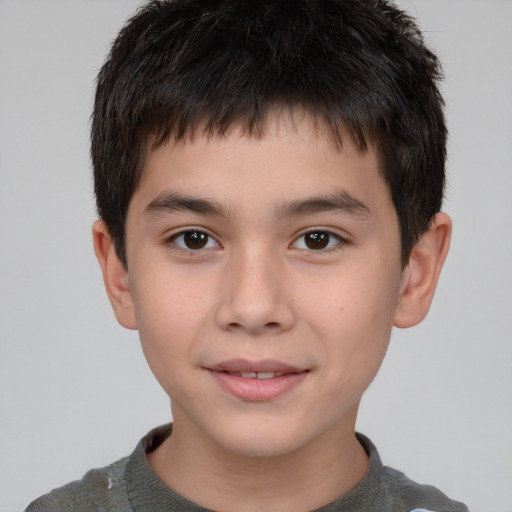 Joyful white child male with short  brown hair and brown eyes