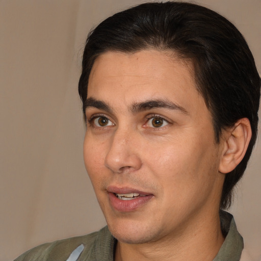 Joyful white adult male with medium  brown hair and brown eyes