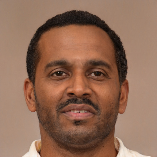 Neutral latino adult male with short  brown hair and brown eyes
