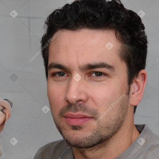 Neutral white young-adult male with short  black hair and brown eyes