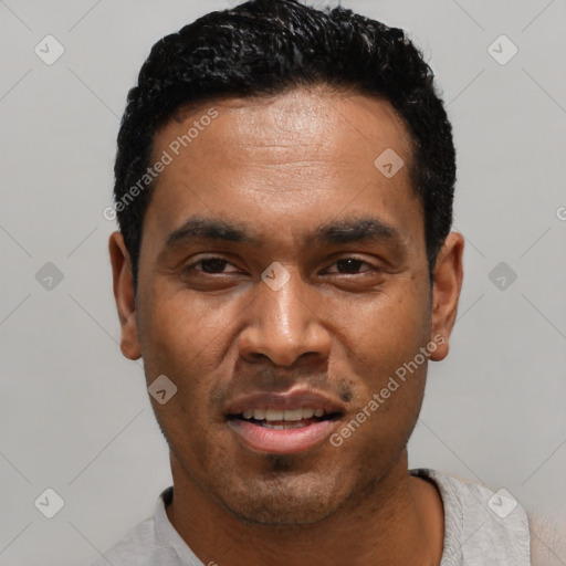 Joyful latino young-adult male with short  black hair and brown eyes