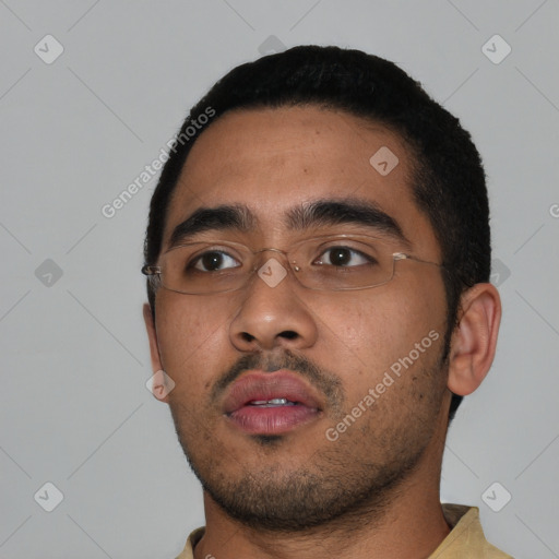 Neutral latino young-adult male with short  black hair and brown eyes
