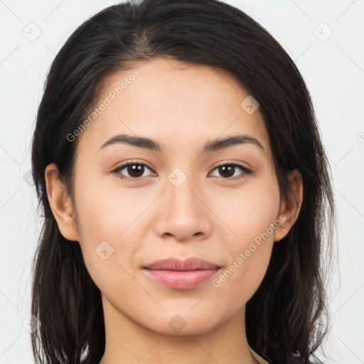 Joyful latino young-adult female with long  brown hair and brown eyes