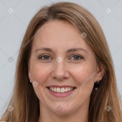 Joyful white adult female with long  brown hair and grey eyes