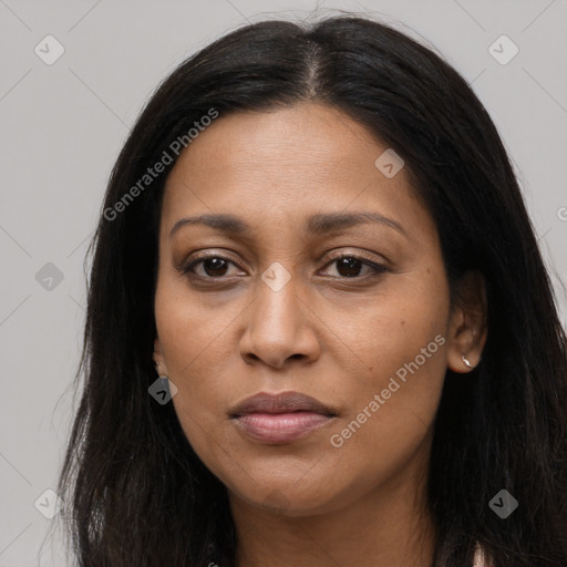 Joyful latino young-adult female with long  black hair and brown eyes