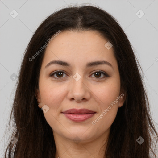 Joyful white young-adult female with long  brown hair and brown eyes