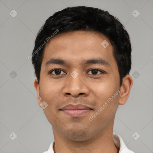 Joyful latino young-adult male with short  black hair and brown eyes