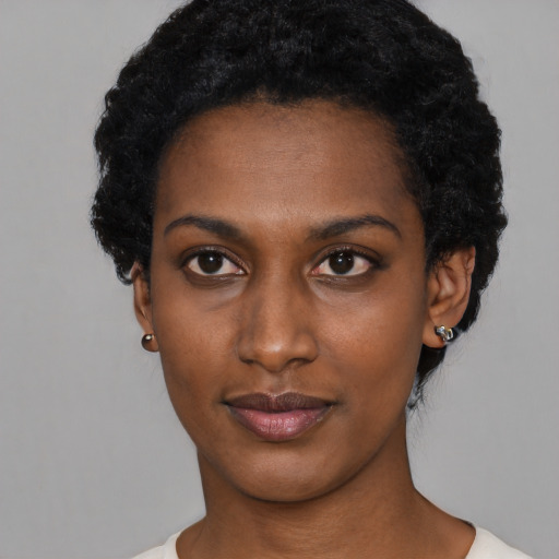 Neutral black young-adult female with short  black hair and brown eyes