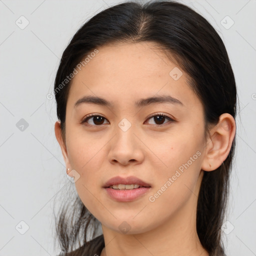 Joyful asian young-adult female with medium  brown hair and brown eyes