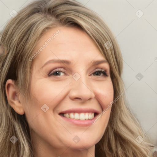 Joyful white adult female with long  brown hair and brown eyes