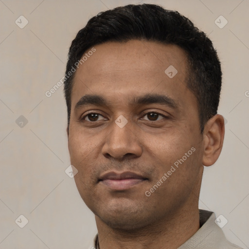 Joyful latino young-adult male with short  black hair and brown eyes