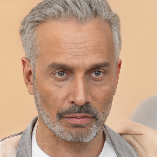 Neutral white middle-aged male with short  gray hair and brown eyes