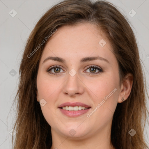 Joyful white young-adult female with long  brown hair and green eyes