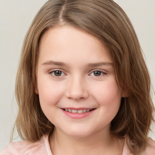 Joyful white child female with medium  brown hair and brown eyes