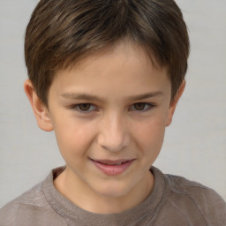 Joyful white child female with short  brown hair and brown eyes