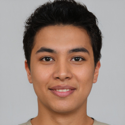 Joyful asian young-adult male with short  brown hair and brown eyes