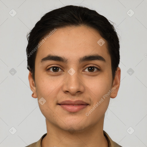 Joyful latino young-adult male with short  brown hair and brown eyes