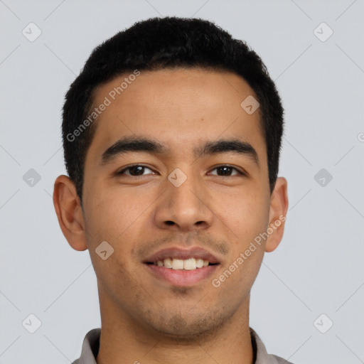 Joyful latino young-adult male with short  black hair and brown eyes