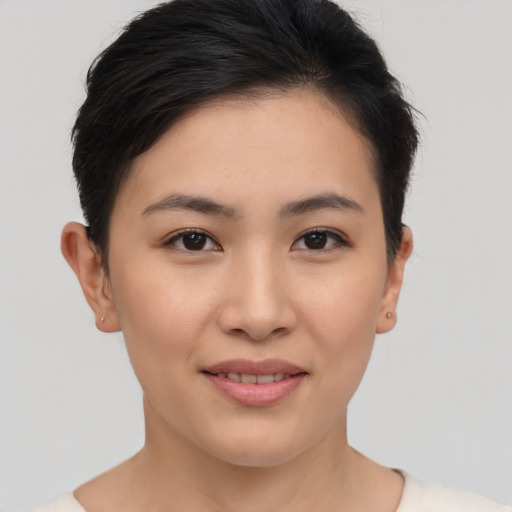 Joyful asian young-adult female with short  brown hair and brown eyes