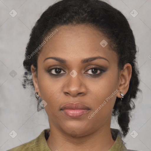 Joyful black young-adult female with medium  brown hair and brown eyes