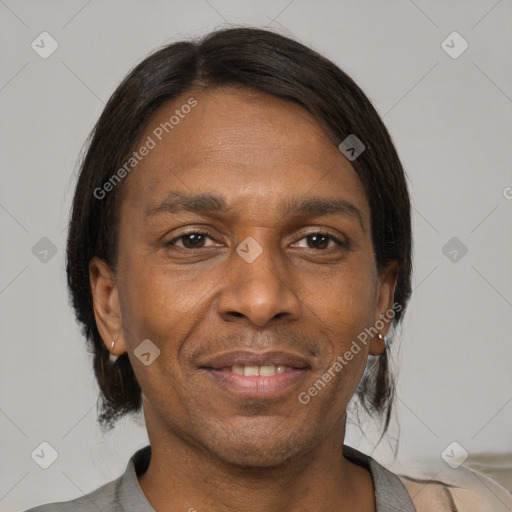 Joyful black adult male with short  black hair and brown eyes