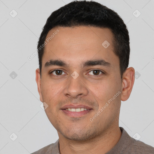 Joyful white young-adult male with short  black hair and brown eyes