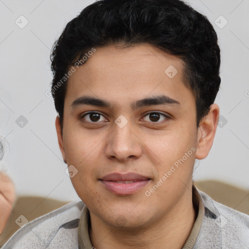 Joyful latino young-adult male with short  brown hair and brown eyes