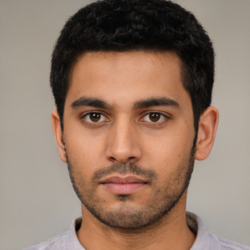Neutral latino young-adult male with short  black hair and brown eyes