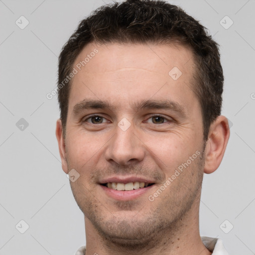 Joyful white young-adult male with short  brown hair and brown eyes