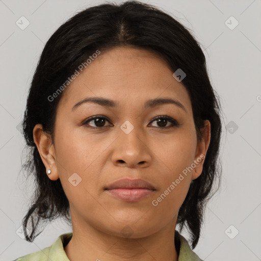 Joyful latino young-adult female with medium  brown hair and brown eyes