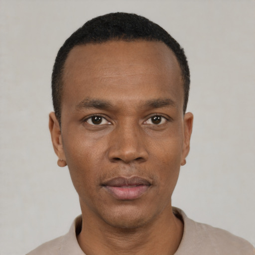 Neutral black young-adult male with short  black hair and brown eyes