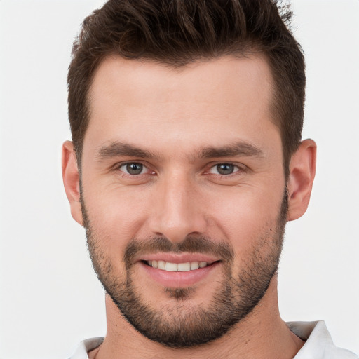 Joyful white young-adult male with short  brown hair and brown eyes