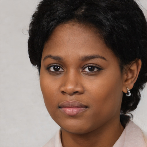 Neutral black young-adult female with medium  black hair and brown eyes