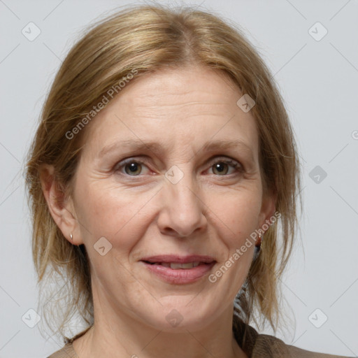 Joyful white adult female with medium  brown hair and grey eyes