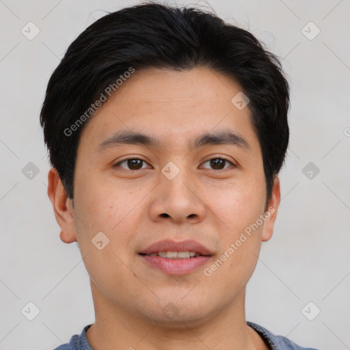 Joyful asian young-adult male with short  brown hair and brown eyes