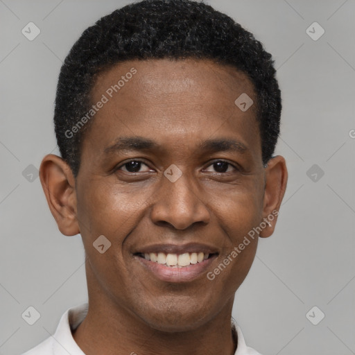 Joyful black young-adult male with short  black hair and brown eyes