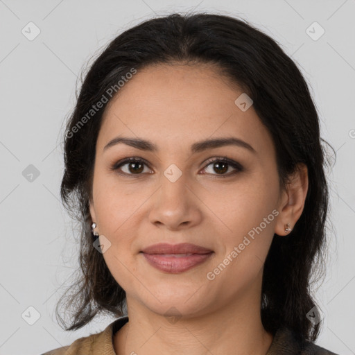 Joyful latino young-adult female with medium  brown hair and brown eyes