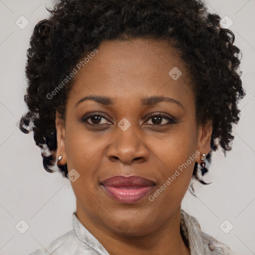 Joyful black adult female with short  brown hair and brown eyes