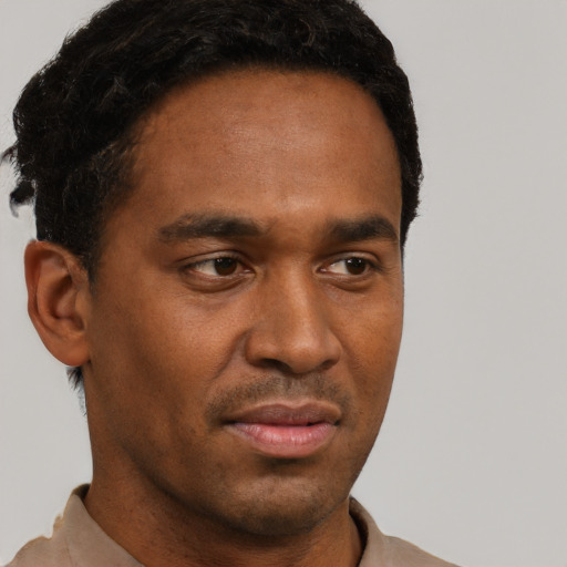 Neutral black young-adult male with short  black hair and brown eyes