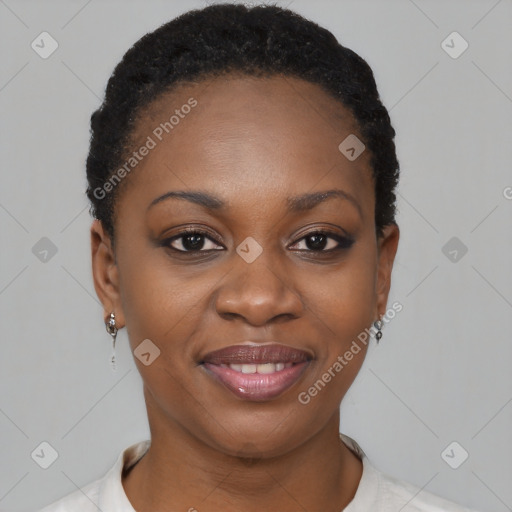 Joyful black young-adult female with short  brown hair and brown eyes