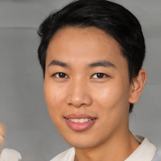 Joyful asian young-adult female with short  brown hair and brown eyes