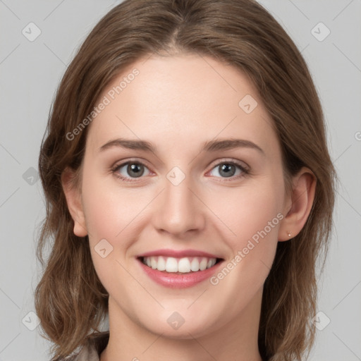 Joyful white young-adult female with medium  brown hair and grey eyes